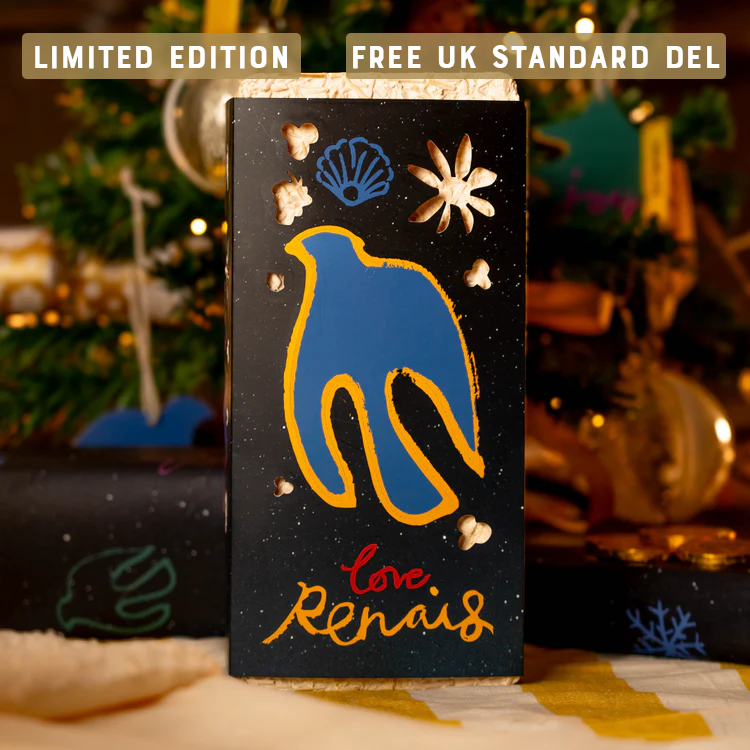 Decorative chocolate packaging with blue and yellow bird design, labeled 'Love Renais,' near holiday decor.